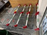 many shopping carts lined up in a store