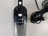 an image of a corded vacuum cleaner on a table