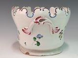 a white bowl with a floral design on it