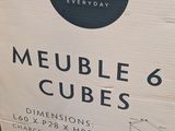 a cardboard box that has a box of cubes inside of it