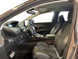 the interior of a car with the door open and the driver ' s seat up