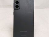 the back of a black samsung galaxy s20 with a camera attached to it