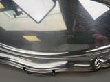 a reflection of a person in a mirror on a table