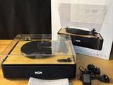 an image of a record player sitting on top of a table next to a box
