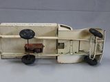 a toy truck with a box on the back of it