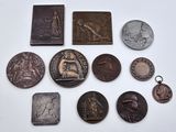 several different types of coins are displayed on a white surface