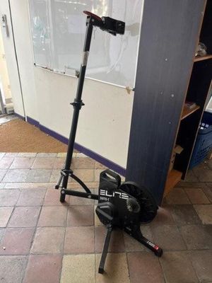 a scooter that is sitting on the ground in front of a door