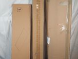 three boxes that are sitting next to each other on a bed