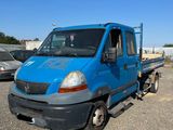 a blue truck that is parked in a parking lot