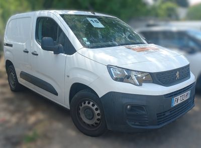 a white van that is parked in a parking lot
