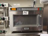 a microwave that is sitting in the middle of a kitchen