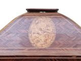a large wooden table with a clock on it
