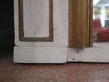 a cat that is sitting on the floor looking out of the window