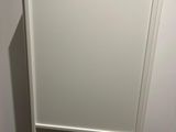 a picture of a picture of a white cabinet in a bathroom
