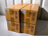 four boxes stacked on top of each other on the floor