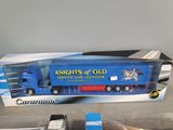 a toy truck that is in a box on the table