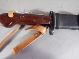 a knife that is laying on top of a table