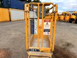 a yellow lift truck that is parked in a parking lot