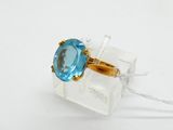 a ring with a blue topaz stone in it