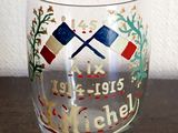 a glass with a picture on it sitting on a table