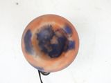 a picture of an orange and blue object on a white surface