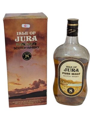 une photo d'une bouteille de whisky écossais « Isle of Jura » à côté d'une boîte