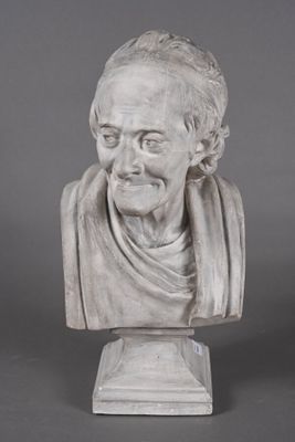 a white marble bust of a man with a scarf around his neck