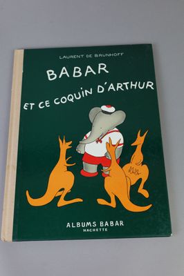 a green book with a picture of a man and a kangaroo on it