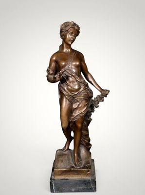 a bronze statue of a woman holding a basket of flowers