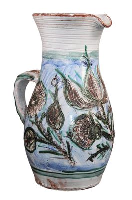 a white vase with a blue and green design on it