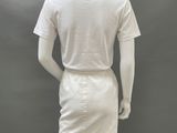 the mannequin is wearing a white shirt and skirt