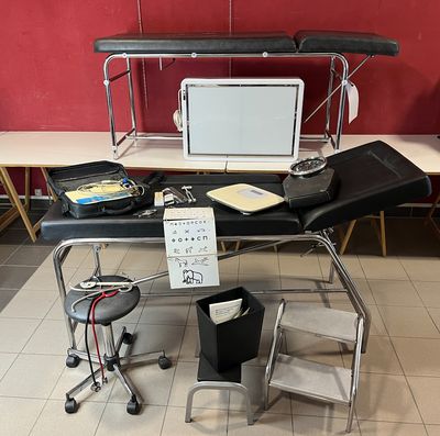 a desk with a laptop and a monitor on top of it