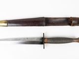 two knives are shown side by side on a white surface