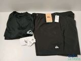 a pair of men ' s black pants with a tag on them
