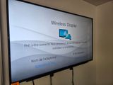 a flat screen tv that is on in a room