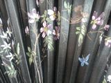 an image of a close up of a fan with flowers and birds on it