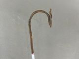 a hand holding a stick with a stick handle on it