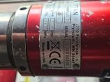a red fire extinguisor sitting on top of a table