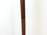 a lamp that is on top of a wooden stand
