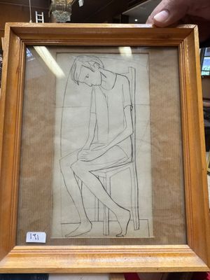 dessin encadré représentant une femme assise sur une chaise dans un magasin