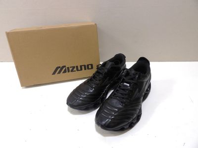 adidas black soccer shoes with box and box on a table