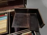 a wooden box filled with a bunch of books