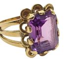 an image of a gold ring with an amethorate stone