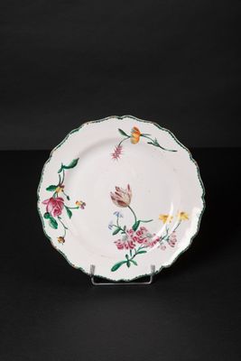 an image of a plate with flowers and butterflies painted on it