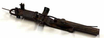 a small wooden object that is on a white surface