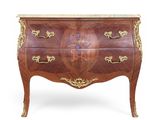 an antique chest of drawers with marble top