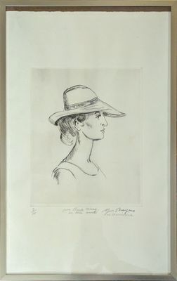 drawing of a woman wearing a hat in a frame on a wall