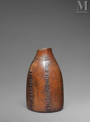 an image of a brown vase sitting on top of a table