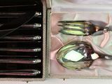 a box with a set of silverware inside of it