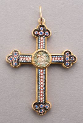 a close up of a cross with a face on it